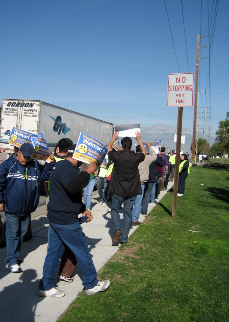 Warehouse workers at a rally outside Schneider facilities in Mira Loma, Calif., in January 2012.